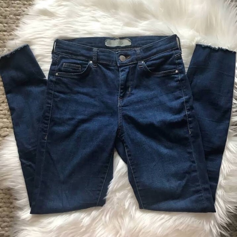 Cute skinny jeans with fringe bottoms.